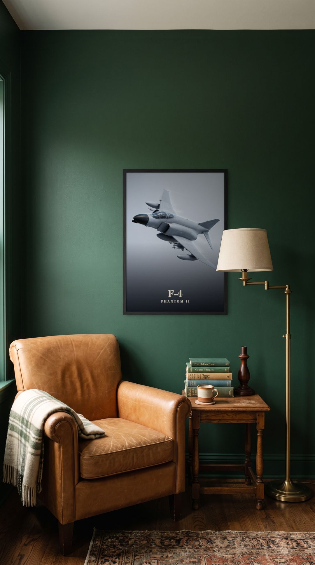 F-4 Phantom II, framed in black, in a cozy dark green reading corner