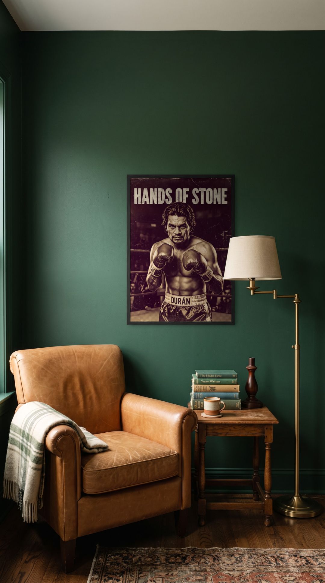 Hands of Stone, framed in black, in a cozy dark green reading corner