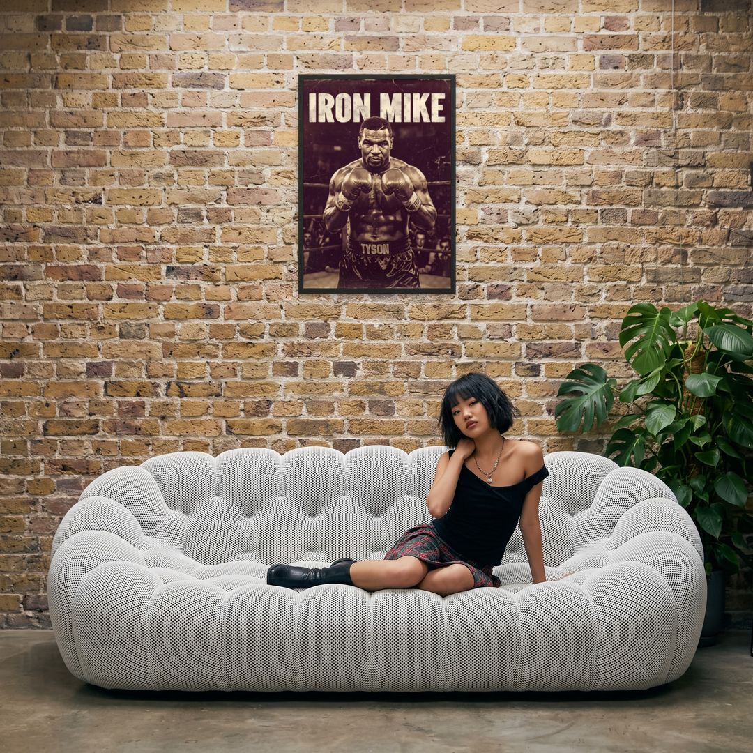 Iron Mike, framed in black, in an industrial loft with tufted sofa