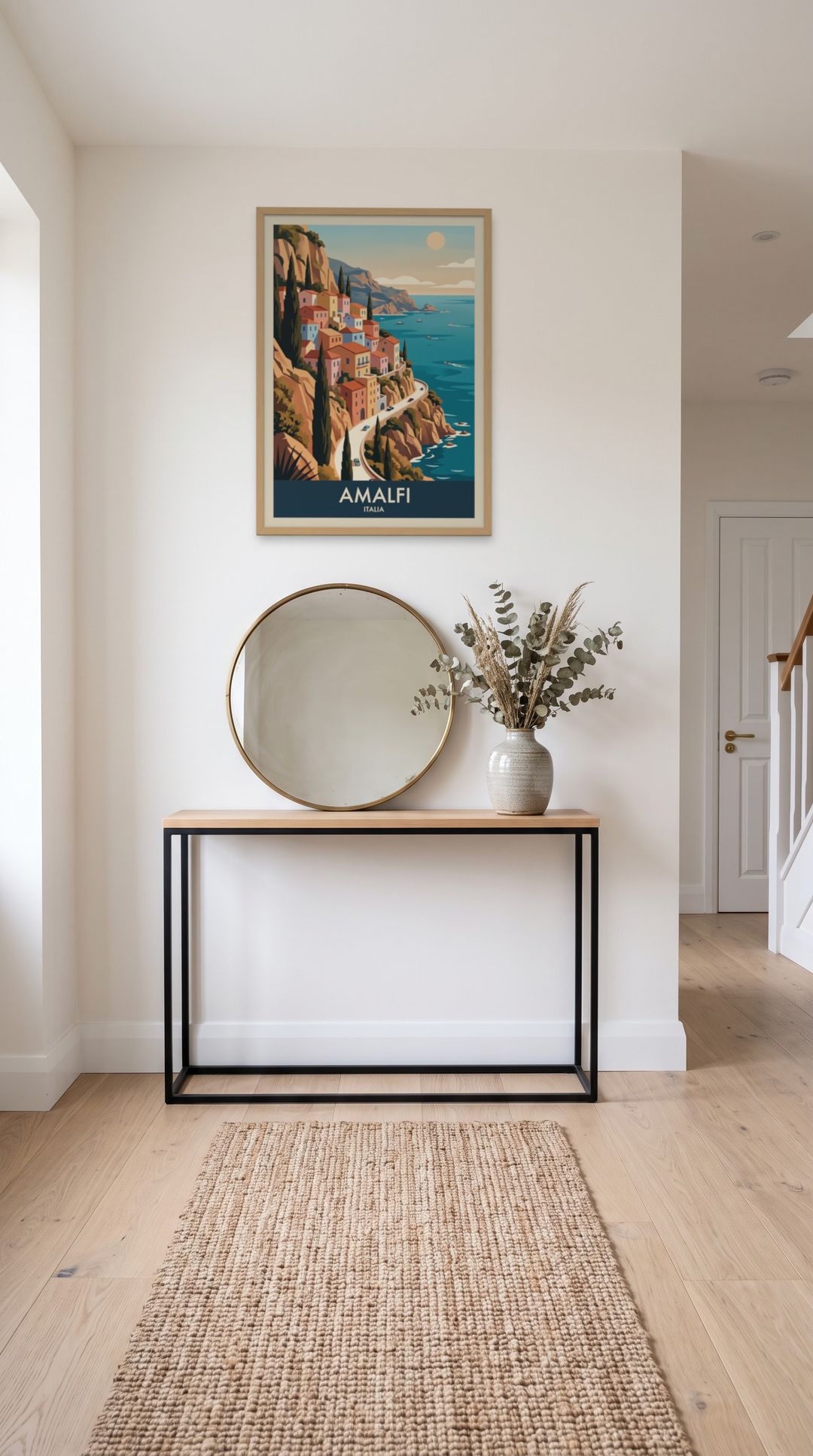 Amalfi, framed in natural wood, in a minimalist entryway with wooden console