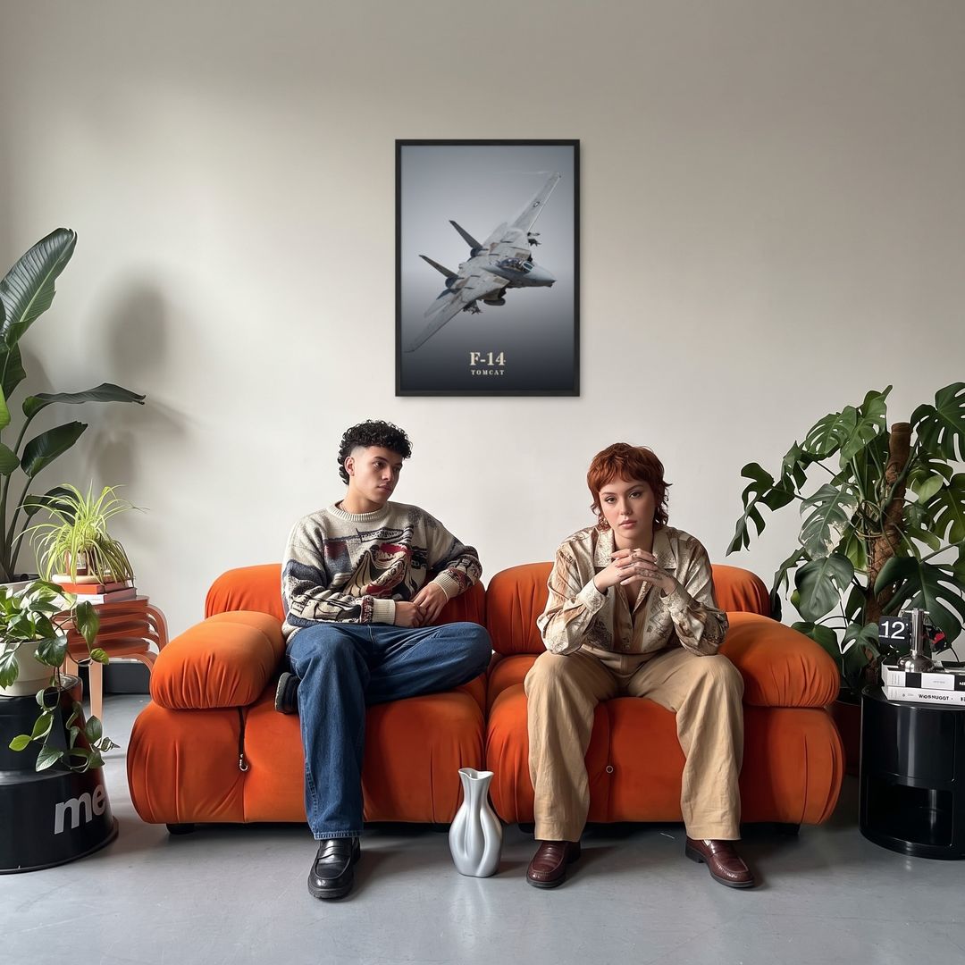 F-14 Tomcat, framed in black, in a retro orange sofa lounge