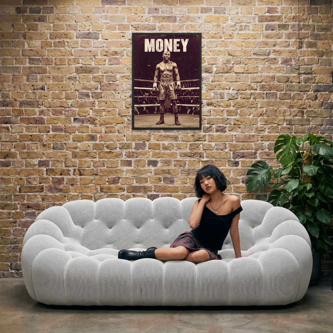Money, framed in black, in an industrial loft with tufted sofa