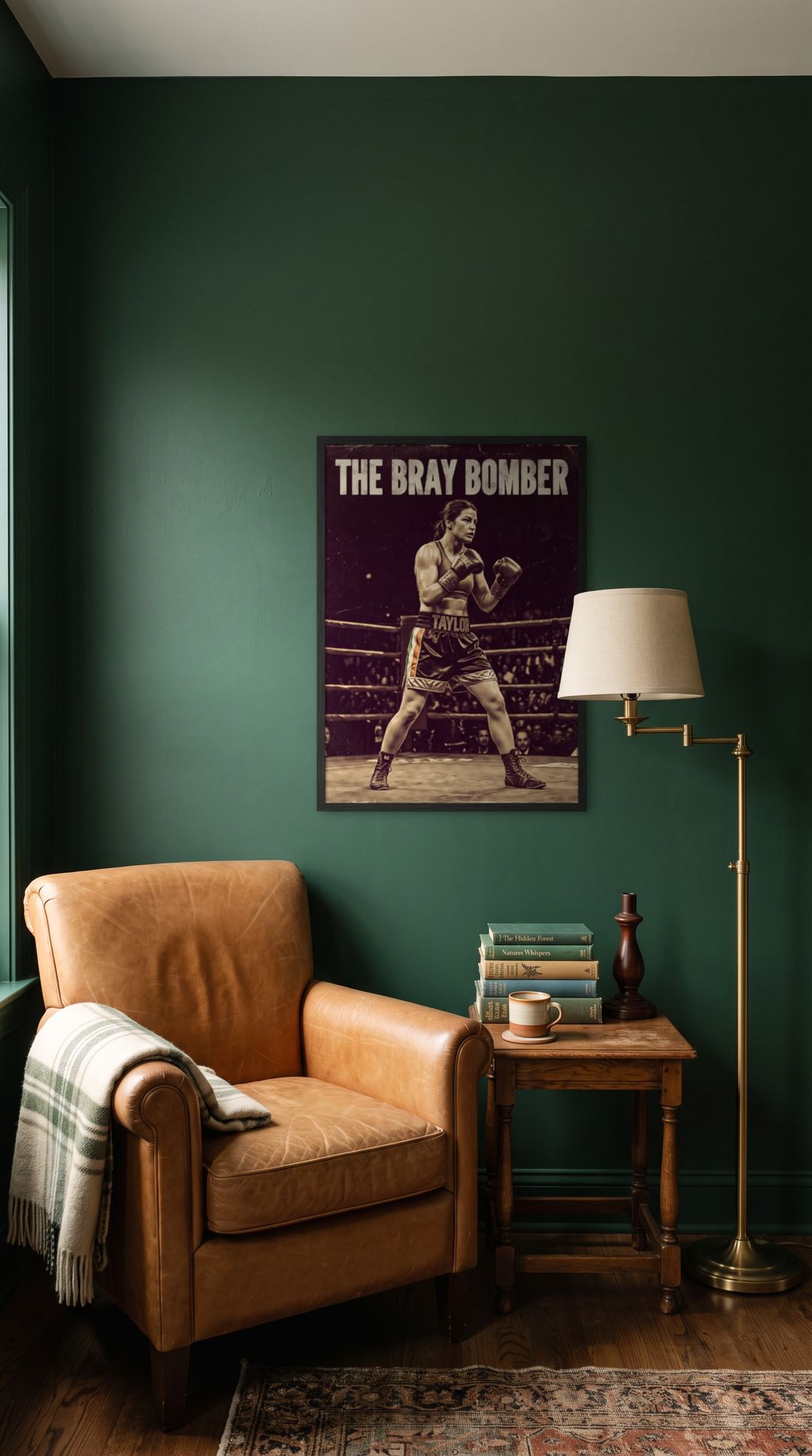 The Bray Bomber, framed in black, in a cozy dark green reading corner