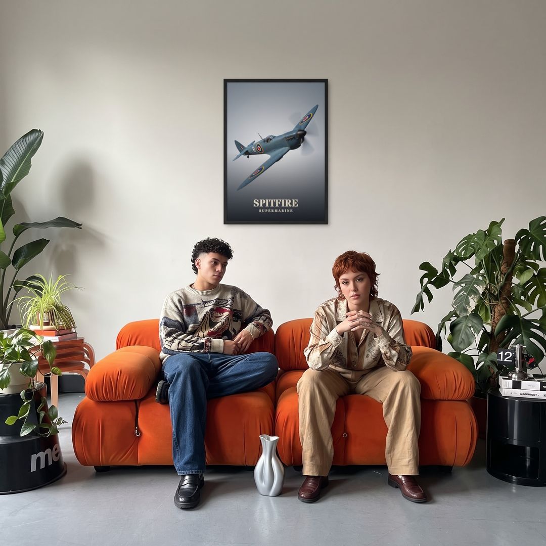 Spitfire, framed in black, in a retro orange sofa lounge