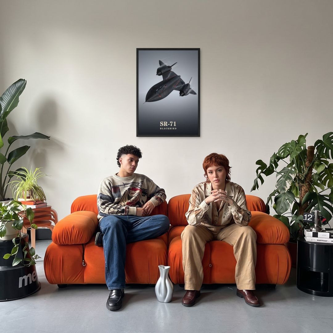 SR-71 Blackbird, framed in black, in a retro orange sofa lounge