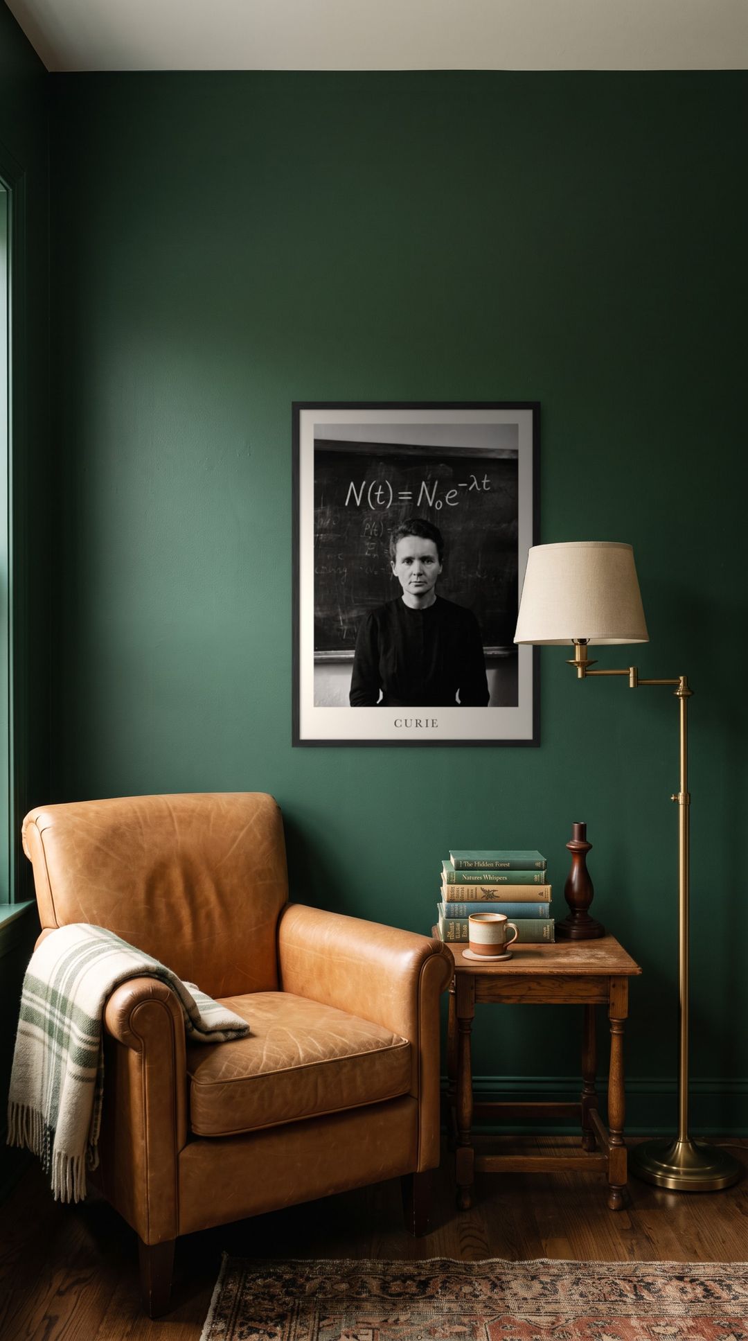 Marie Curie, framed in black, in a cozy dark green reading corner