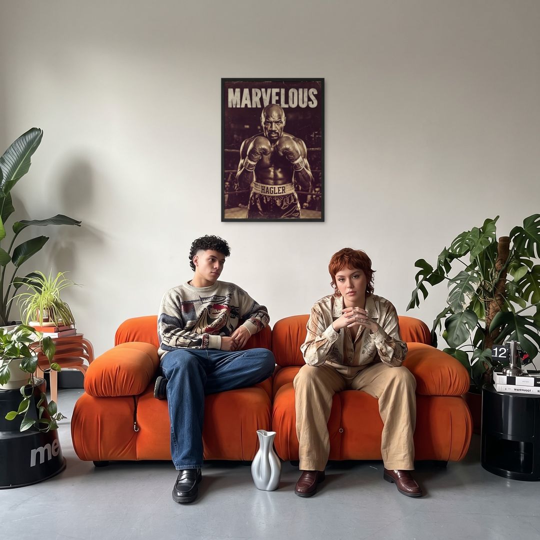 Marvelous Champion, framed in black, in a retro orange sofa lounge