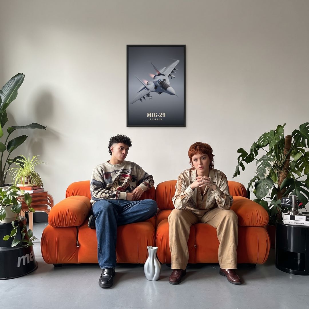 MiG-29 Fulcrum, framed in black, in a retro orange sofa lounge