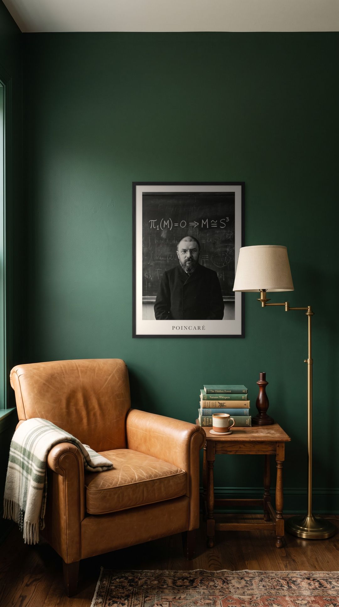 Henri Poincaré, framed in black, in a cozy dark green reading corner