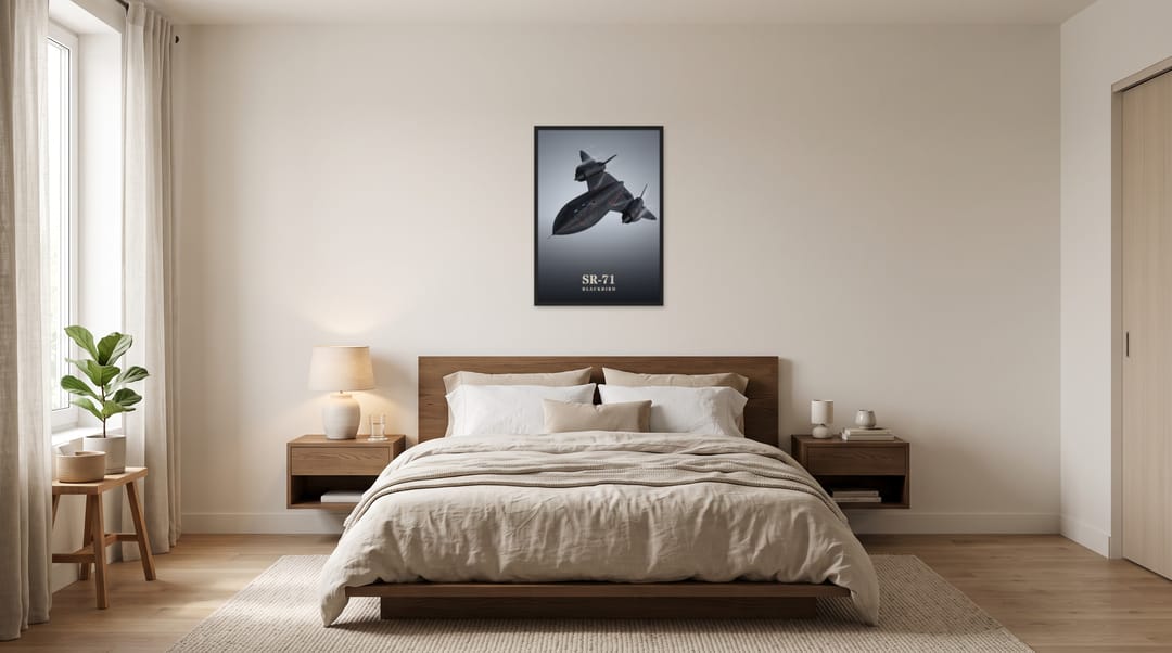 SR-71 Blackbird, framed in black, in a minimalist warm bedroom