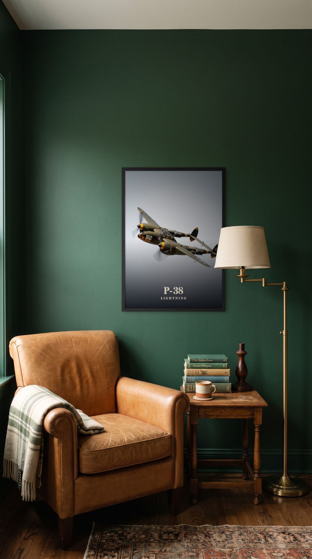 P-38 Lightning, framed in black, in a cozy dark green reading corner