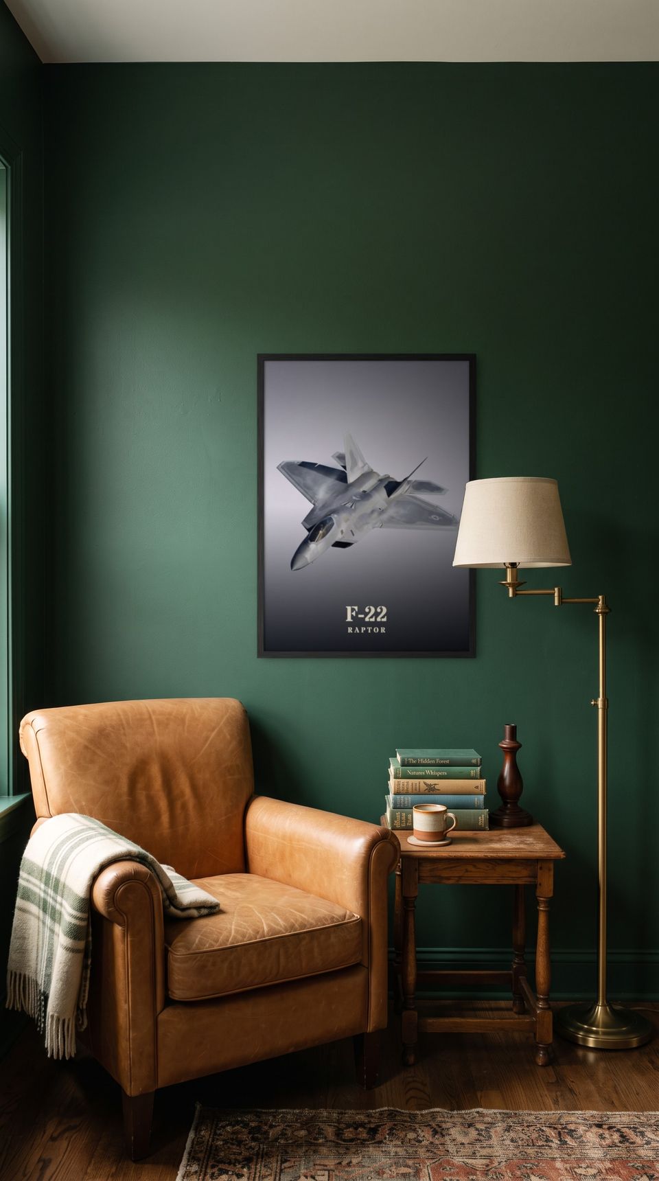 F-22 Raptor, framed in black, in a cozy dark green reading corner