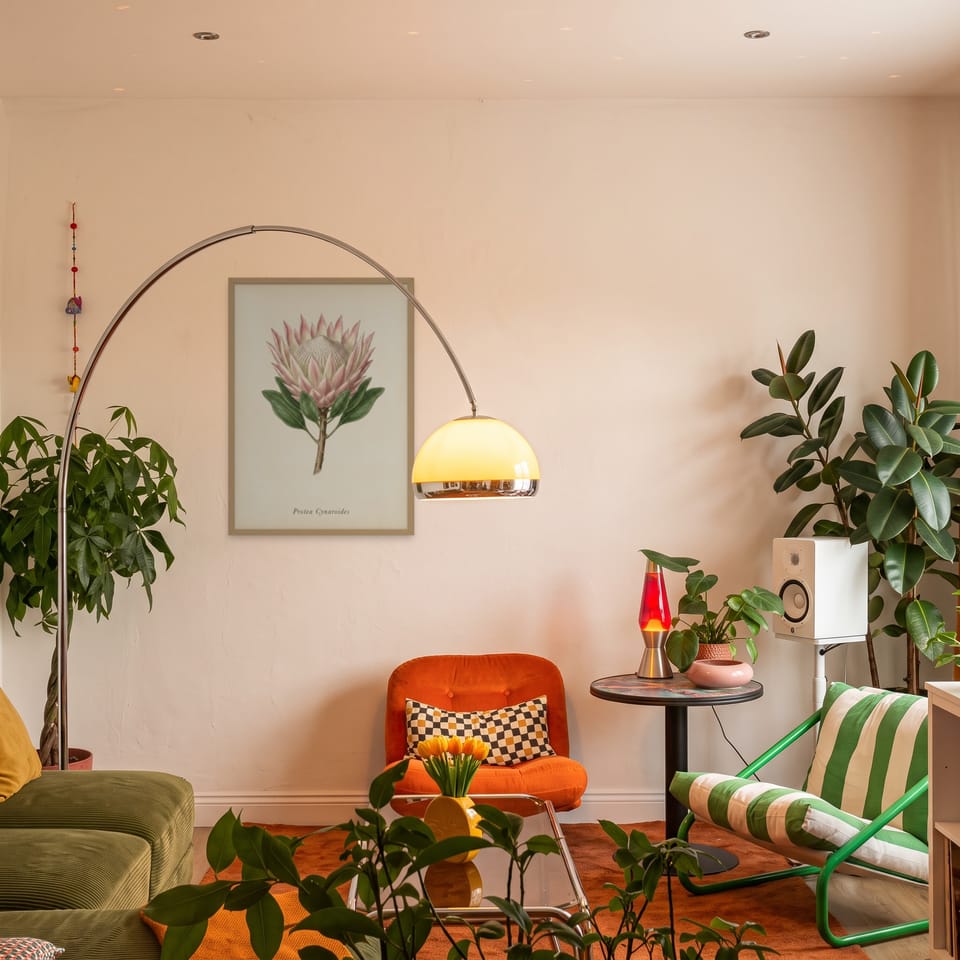 King Protea, framed in natural wood, in an eclectic mid-century living room