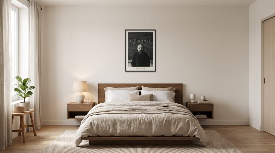 Henri Poincaré, framed in black, in a minimalist warm bedroom